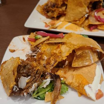 Guy Fieri's Cherokee Kitchen + Bar - Trash Nachos - New American Near Me - Cherokee, North Carolina Guy Fieri's Cherokee Kitchen + Bar - Trash Nachos - New American Near Me - Cherokee, North Carolina