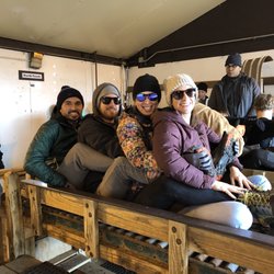 Toboggan Run - Four adults loaded and ready to go