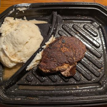 LongHorn Steakhouse - I don't know what this liquid is coming out of my mashed potatoes. Maybe it's spilled from the shrunken head steak? - Steakhouses Near Me - East Point, Georgia