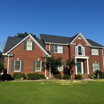 Roof Tech Solutions - a red brick house with white trim - Roofing Near Me - Athens, Alabama