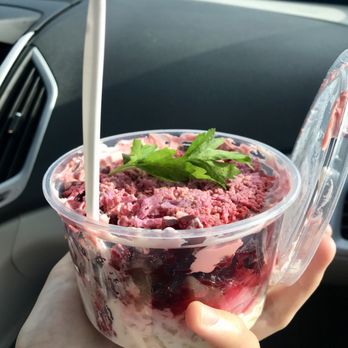 Russian Food - a hand holding a plastic container filled with food - Delis Near Me - Flagler Beach, Florida Russian Food - a hand holding a plastic container filled with food - Delis Near Me - Flagler Beach, Florida
