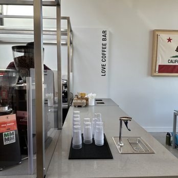 Love Coffee Bar - a counter with cups of coffee on it - Coffee & Tea Near Me - Los Angeles, California