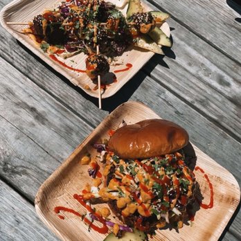 Hye Cider - two plates of food on a picnic table - Cideries Near Me - Johnson City, Texas