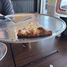 The leftover 1 slice of amazing cheese pizza (XL)