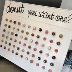 Impressive wall of 60 donuts, add a unique dessert treat to your next party.