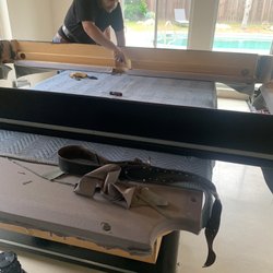 Valley Pool Table Pro installers prepping to put new pool felt