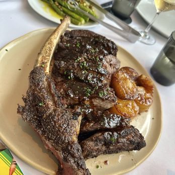 Bourbon Steak - Tomahawk steak (48oz) with asparagus and potato side - Steakhouses Near Me - Glendale, California