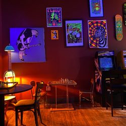 Mutiny Trinidad - There are several areas to sit and read. Or play on one of the several chess boards, board games or old school arcade game.