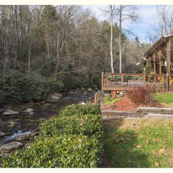 Roaring River Vineyards - One of the deck areas of one of the cabins overlooking the river. - Wineries Near Me - Traphill, North Carolina