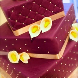 Diaz-Tabora Wedding Cake by Karla (square quilted purple wedding cake w/ white pearls, gumpaste calla lilies and silver ribbon)