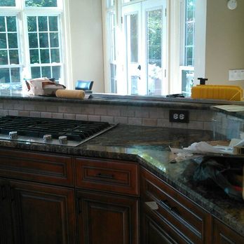 Ramsey Contracting - a kitchen counter with a stove top - General Contractors Near Me - Indian Trail, North Carolina Ramsey Contracting - a kitchen counter with a stove top - General Contractors Near Me - Indian Trail, North Carolina