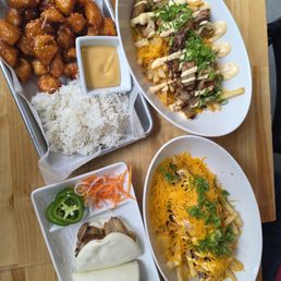 Happy belly buns, bulgogi kimchi fries, street popcorn chicken (korean style w/ rice), loaded chashu fries Happy belly buns, bulgogi kimchi fries, street popcorn chicken (korean style w/ rice), loaded chashu fries