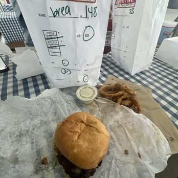 Mighty Fine Burgers - The Classic w/ onion rings - Burgers Near Me - Hutto, Texas Mighty Fine Burgers - The Classic w/ onion rings - Burgers Near Me - Hutto, Texas