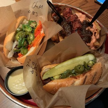 Wursthaus - Bison drunken fries, spicy polish on a grinder, and a spicy chicken mango on a grinder. - Pubs Near Me - Santa Ana, California
