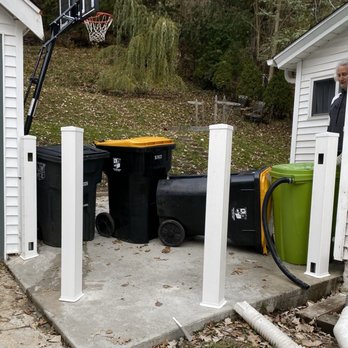 FENCEWI - Garbage can fence with new poles in place - Fences & Gates Near Me