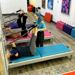 Swan Movement Arts - Practice Pilates and Yoga in beautiful colorful studio .