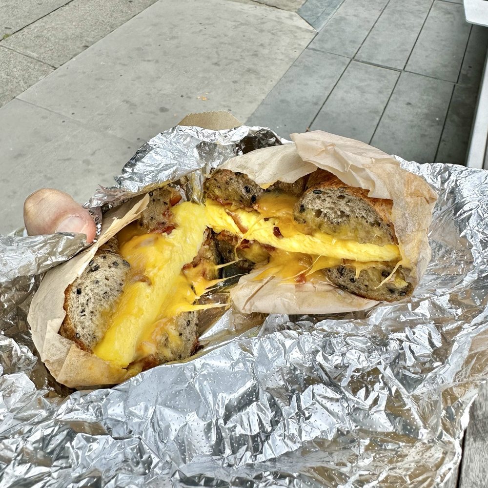 Midnite Bagel - Breakfast sandwich: bacon, egg & cheddar on buckwheat black-sesame bagel + tax & tip -$14 - Bagels Near Me - San Francisco, California Midnite Bagel - Breakfast sandwich: bacon, egg & cheddar on buckwheat black-sesame bagel + tax & tip -$14 - Bagels Near Me - San Francisco, California