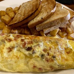 Audrey's Kitchen & Wyatt's Lounge - 2 egg omelette, choice of 2 fillings plus cheese, rye toast and chunky hashbrowns - $11.5. Generous amount of food, omelette was good.