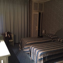 Hotel Il Burchiello - This is my room. For the night. Three beds. Seems clean but a bit dated.