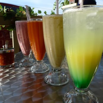Loving Hut - Smoothies (from L to R): rose lemonade, carrot juice, mango tango, sunny forest - Vegan Near Me - Orange, California Loving Hut - Smoothies (from L to R): rose lemonade, carrot juice, mango tango, sunny forest - Vegan Near Me - Orange, California