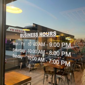Pho Tiger - a business hours sign in the window - Vietnamese Near Me - Tigard, Oregon