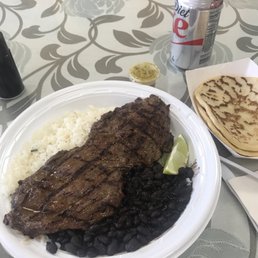 Steak, black beans, rice, thick tortillas. Pretty decent. Very hard to cut with plastic knife and fork though.