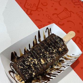 The Paleta Bar - Cookies and cream paleta dipped in milk chocolate drizzled with dark chocolate/caramel and covered with peanuts. - Ice Cream & Frozen Yogurt Near Me - Houston, Texas The Paleta Bar - Cookies and cream paleta dipped in milk chocolate drizzled with dark chocolate/caramel and covered with peanuts. - Ice Cream & Frozen Yogurt Near Me - Houston, Texas