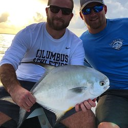 Off the Hook Fishing Charters - Jacob with his first ever permit