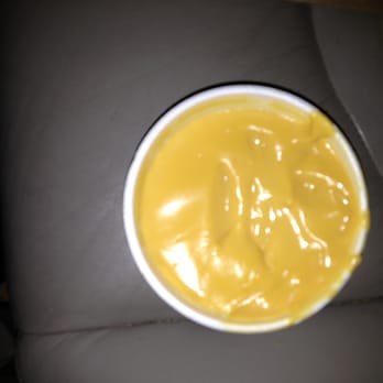 Wingstop - "Cheese sauce" sold by Wingstop to go with the fries. - Chicken Wings Near Me - Independence, Missouri