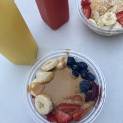 Aneu Kitchen - Tropical Bowl and Strawberry Lemonade (back), Peanut Butter Acai Bowl and Orange Ginger infused water (front)