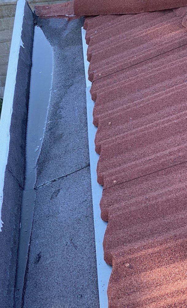 Slide of Adams Roofing