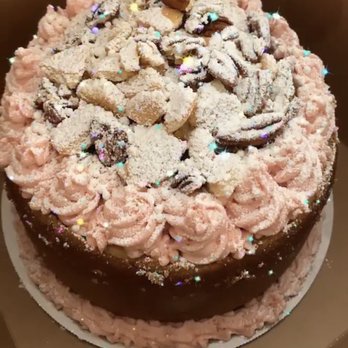 aninaye - a chocolate cake with pink frosting and sprinkles - Desserts Near Me