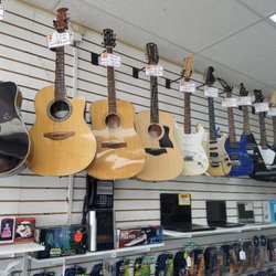 Todds Pawn Shop - An array of guitars!!