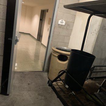 Boca Raton Condominiums - Trash cart in passage to elevator - Condominiums Near Me - Las Vegas, Nevada Boca Raton Condominiums - Trash cart in passage to elevator - Condominiums Near Me - Las Vegas, Nevada