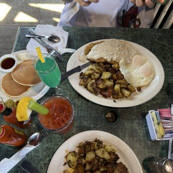 Red Apple Cafe - Salmon Benedict & potatoes  country fried steak & potatoes served with two pancakes   Bloody Mary and Mermaid Mimosa. - Breakfast & Brunch Near Me - Fresno, California