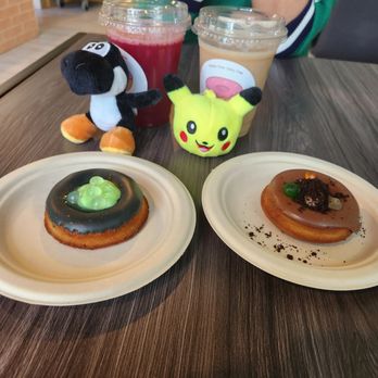 Mikiko Mochi Donuts - Our donuts (Witch's brew and Dirt Cup) and two prizes my boyfriend won here. - Donuts Near Me - Beaverton, Oregon Mikiko Mochi Donuts - Our donuts (Witch's brew and Dirt Cup) and two prizes my boyfriend won here. - Donuts Near Me - Beaverton, Oregon