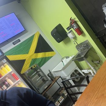Tropics Jerk Center - Behind counter where you pay - Caribbean Near Me - Lithonia, Georgia Tropics Jerk Center - Behind counter where you pay - Caribbean Near Me - Lithonia, Georgia