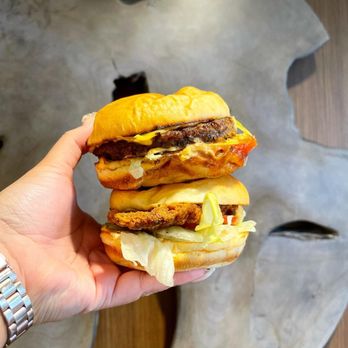 Triple O's - a hand holding a sandwich - Fast Food Near Me - Vancouver, British Columbia Triple O's - a hand holding a sandwich - Fast Food Near Me - Vancouver, British Columbia