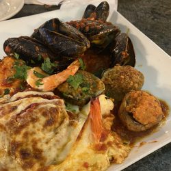 Antonella's Restaurant - HOT ANTIPASTO $17.95 stuffed clams, mushrooms, eggplant, shrimp, & mussels