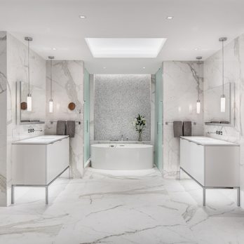 Becker Works - a modern bathroom with marble floors and walls - General Contractors Near Me - Chicago, Illinois Becker Works - a modern bathroom with marble floors and walls - General Contractors Near Me - Chicago, Illinois