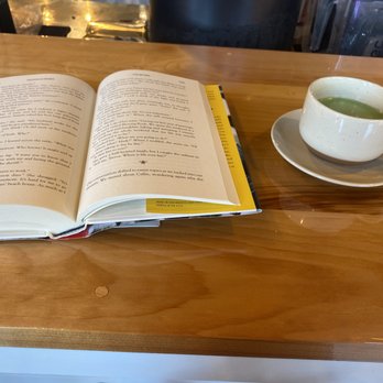 Atman Juice Bar & Cafe - Reading my book drinking the matcha tea - Coffee & Tea Near Me - Watertown, New York