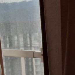 Filthy window makes it look foggy outside when it's actually bright and sunny. Filthy window makes it look foggy outside when it's actually bright and sunny.
