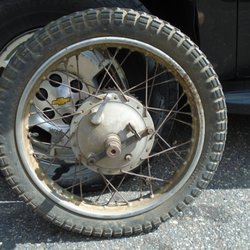 Tommy's Cycle Shop - My vintage Ariel wheel - with old antique rubber that needs to be removed.
