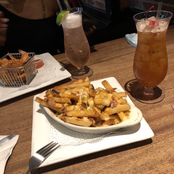 Playwright Celtic Pub - Nacho Fries and Coconut Shrimp Mai Tai Watermelon Vodka - New American Near Me - New York, New York Playwright Celtic Pub - Nacho Fries and Coconut Shrimp Mai Tai Watermelon Vodka - New American Near Me - New York, New York