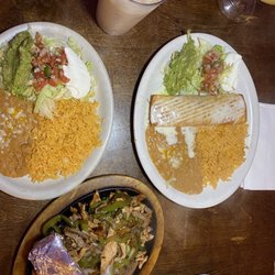 Los Aztecas - Chicken Chimichanga and Fiesta Fajitas single with rice beans guacamole pico salad and sour cream.