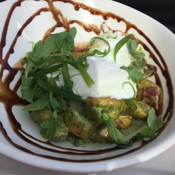 Edina Grill - Potato gnocchi in pesto with mushrooms & bacon & poached eggs - amazing! - American Near Me - Edina, Minnesota