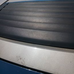 Yeah, that splotch is dirt! The employee had to take my vent cover back on after their car wash broke it!!! Don't go here!!