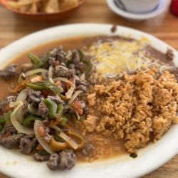 Delgados Restaurant - Steak Picado rice and beans.