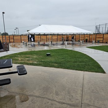 The Rush Event Center - tables and umbrellas in the rain - Amusement Parks Near Me - Evans, Colorado The Rush Event Center - tables and umbrellas in the rain - Amusement Parks Near Me - Evans, Colorado