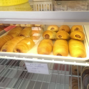 The Donut Palace - Kolaches...don't know what they are, but they're delicious!! Hot dogs, cheeses wrapped in a delicious, light, tender crust. - Donuts Near Me